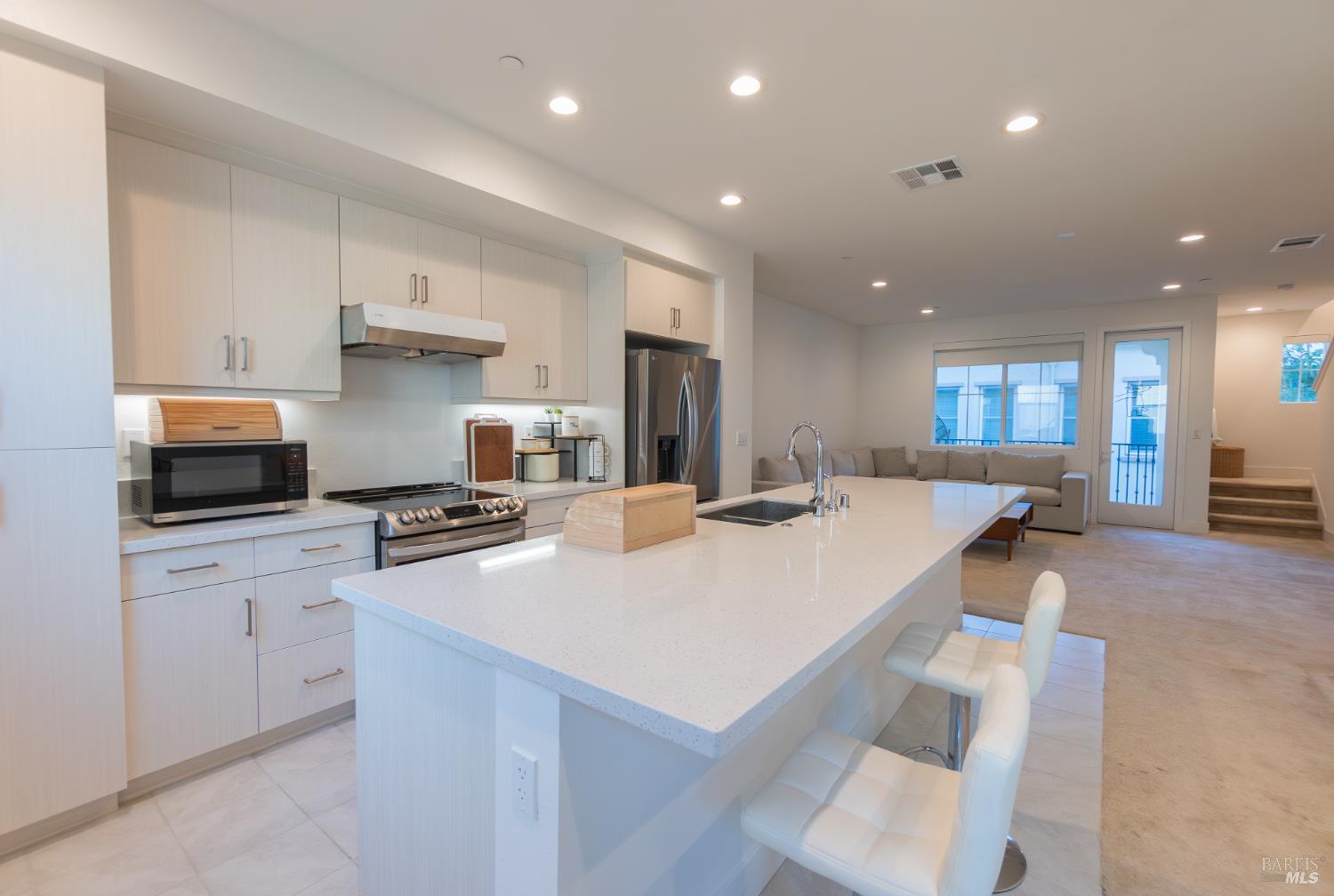 306 Rockview Road Novato, CA 94949 - Photo 14 of 37 a kitchen with a sink a stove a refrigerator and white cabinets