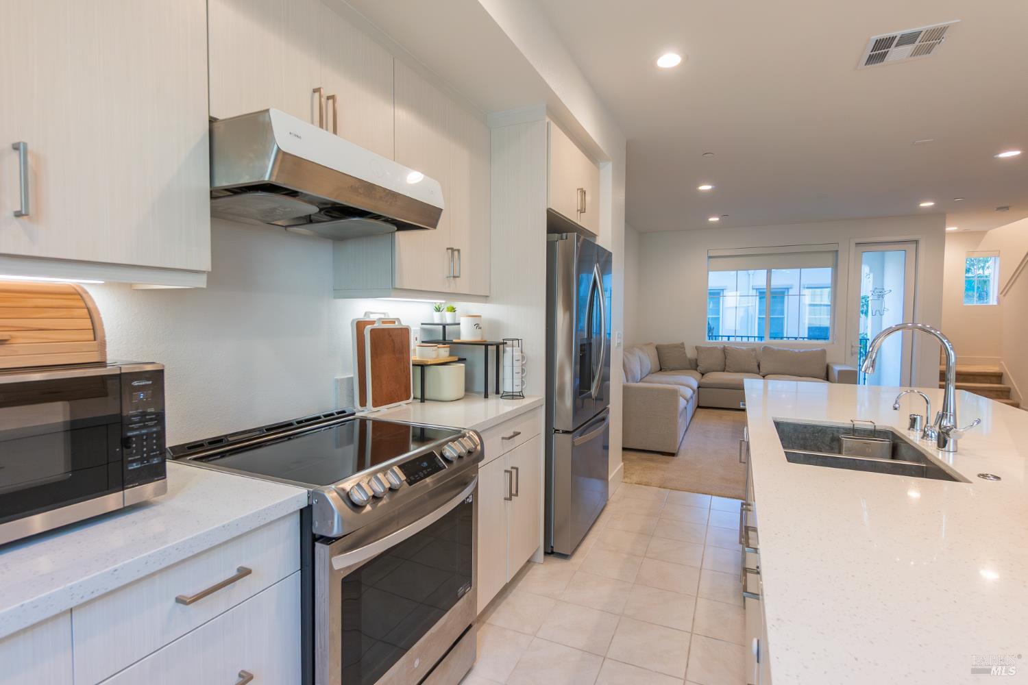 306 Rockview Road Novato, CA 94949 - Photo 15 of 37 a kitchen with stainless steel appliances kitchen island granite countertop a stove and a sink