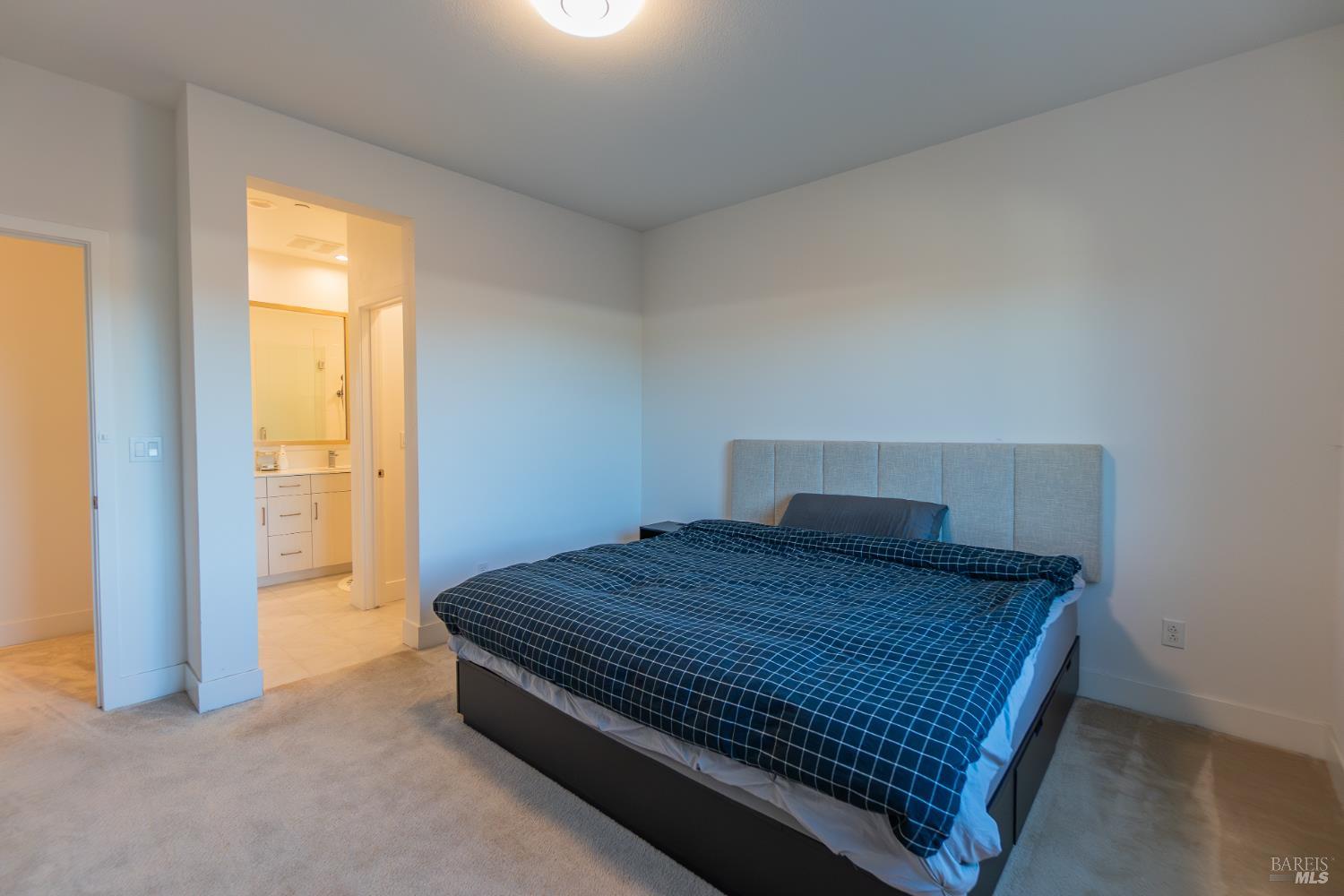 306 Rockview Road Novato, CA 94949 - Photo 23 of 37 a bedroom with a bed and wooden floor