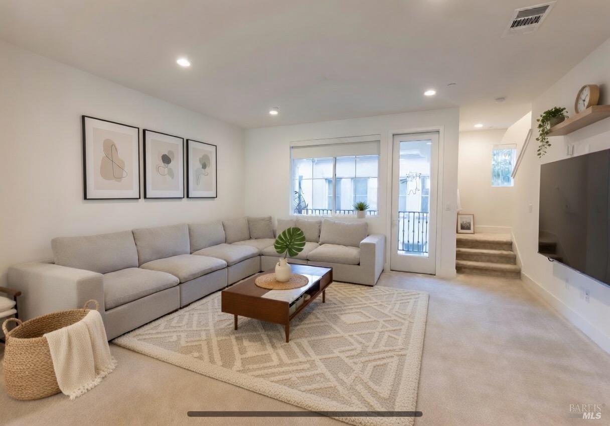 306 Rockview Road Novato, CA 94949 - Photo 10 of 37 a living room with furniture a flat screen tv and a window