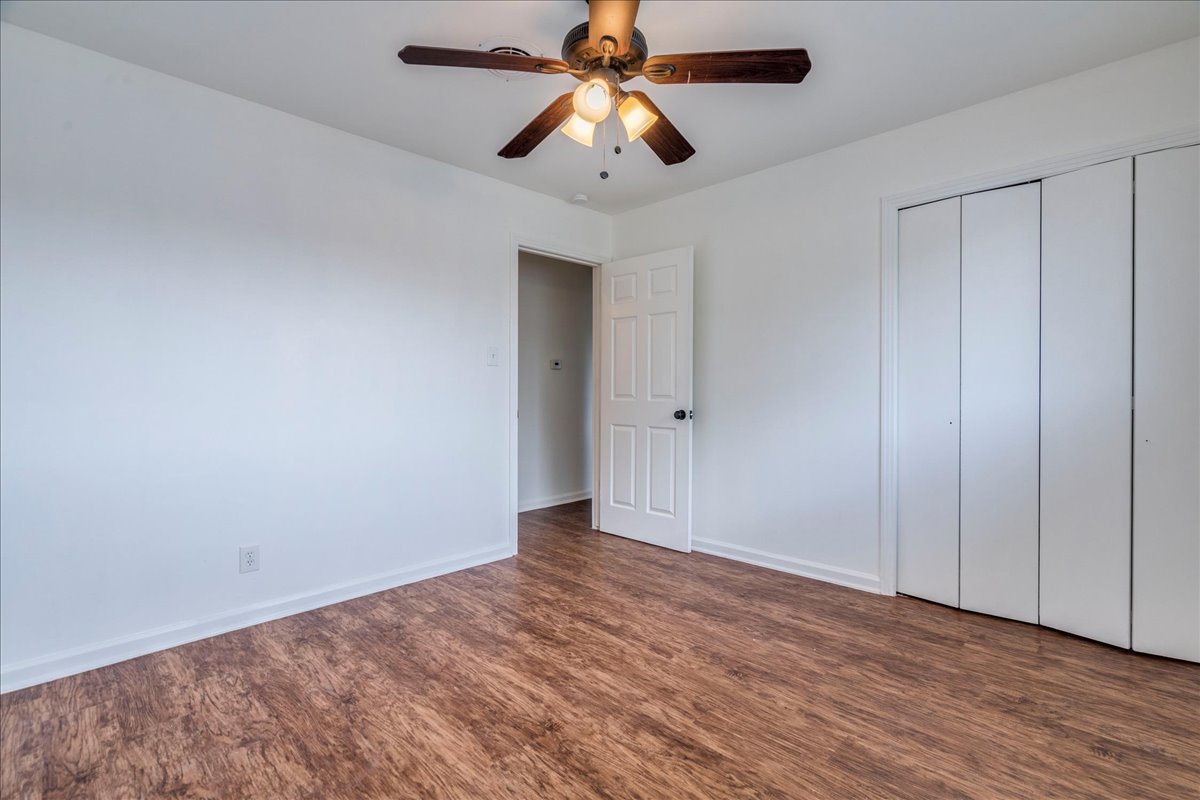 1417 Braes Ridge Drive, Unit B Austin, TX 78723 - Photo 9 of 22 a view of an empty room and chandelier fan