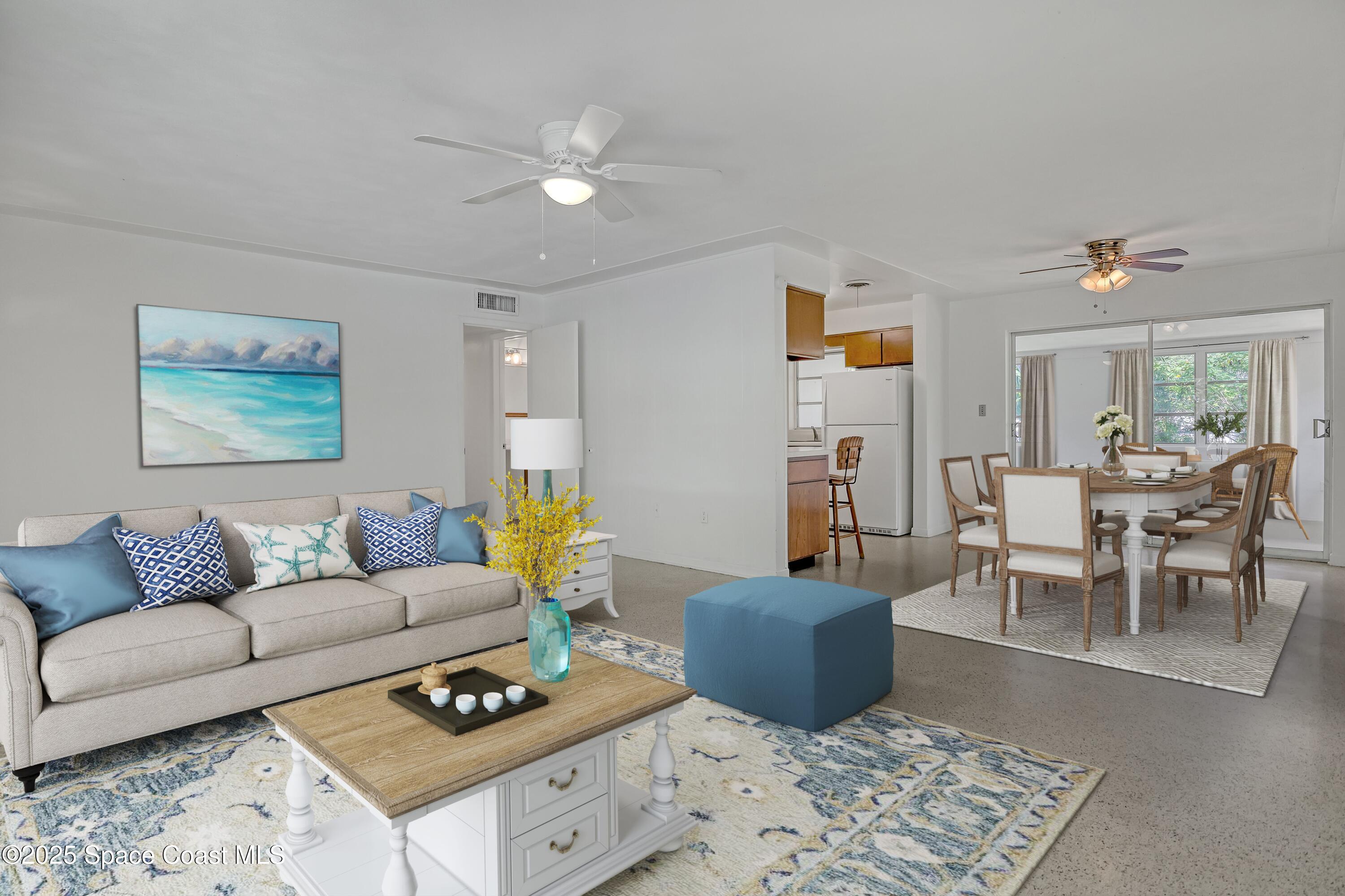 955 Samar Road Cocoa Beach, FL 32931 - Photo 12 of 37 a living room with furniture and a rug