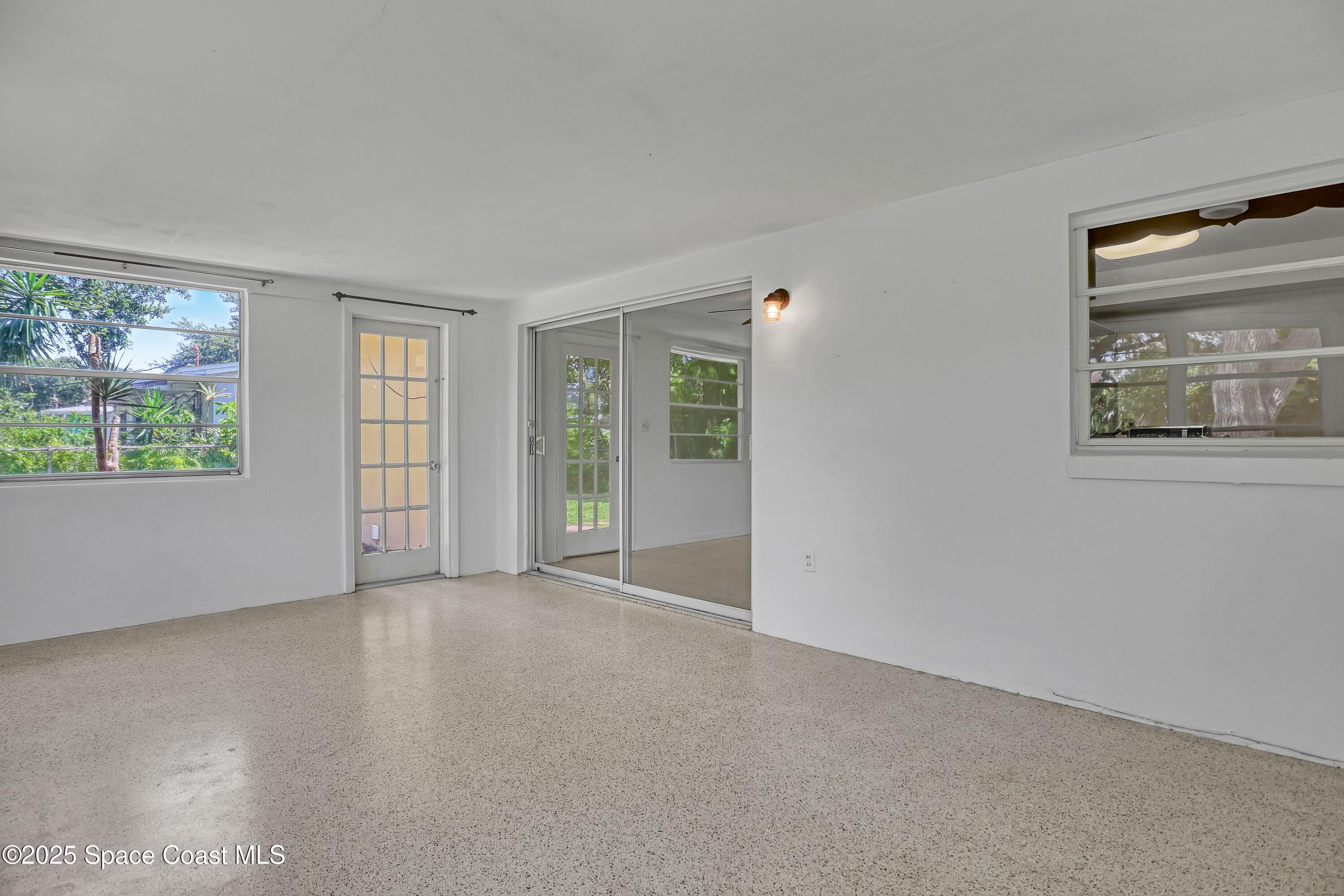 955 Samar Road Cocoa Beach, FL 32931 - Photo 15 of 37 an empty room with windows