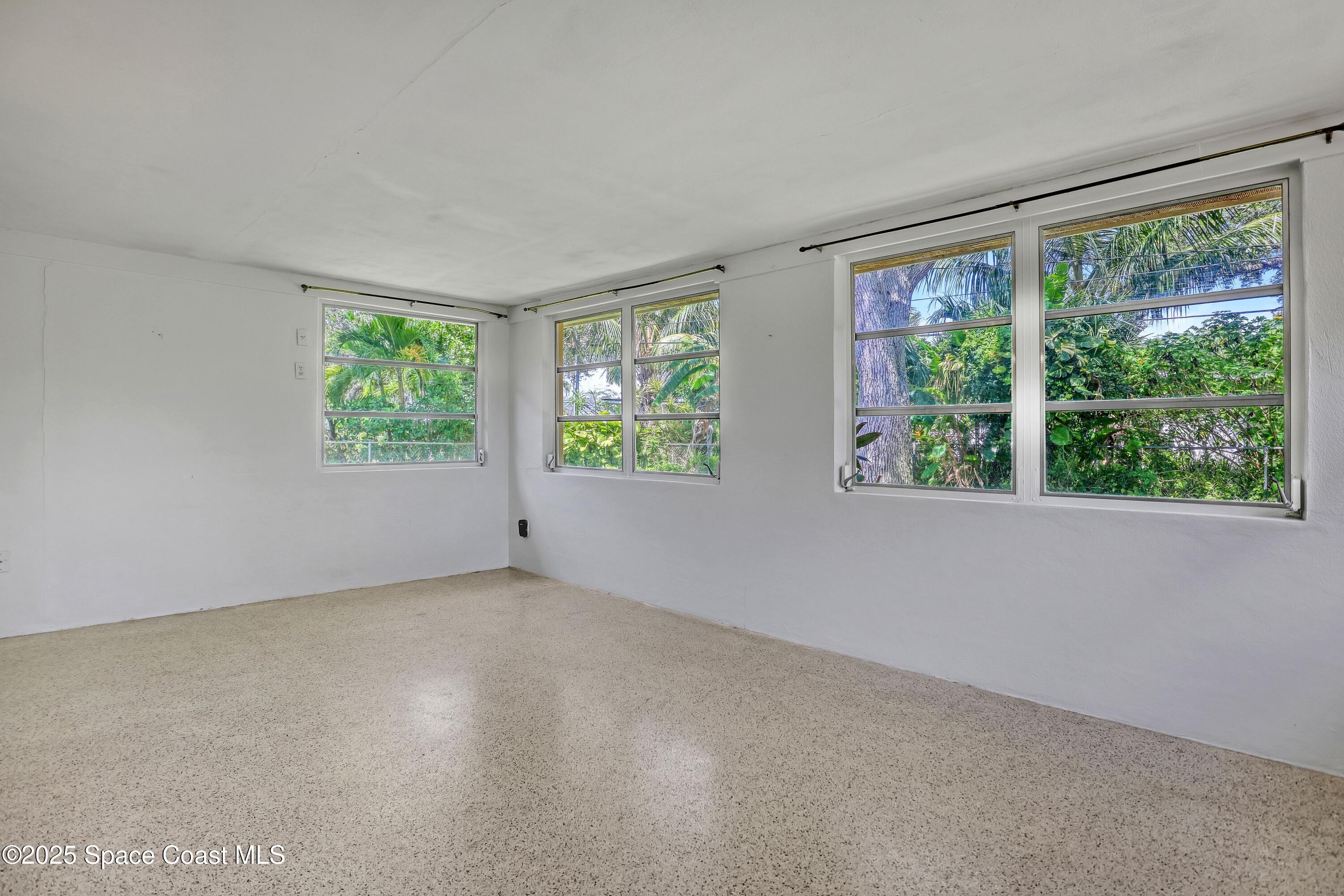 955 Samar Road Cocoa Beach, FL 32931 - Photo 17 of 37 an empty room with windows