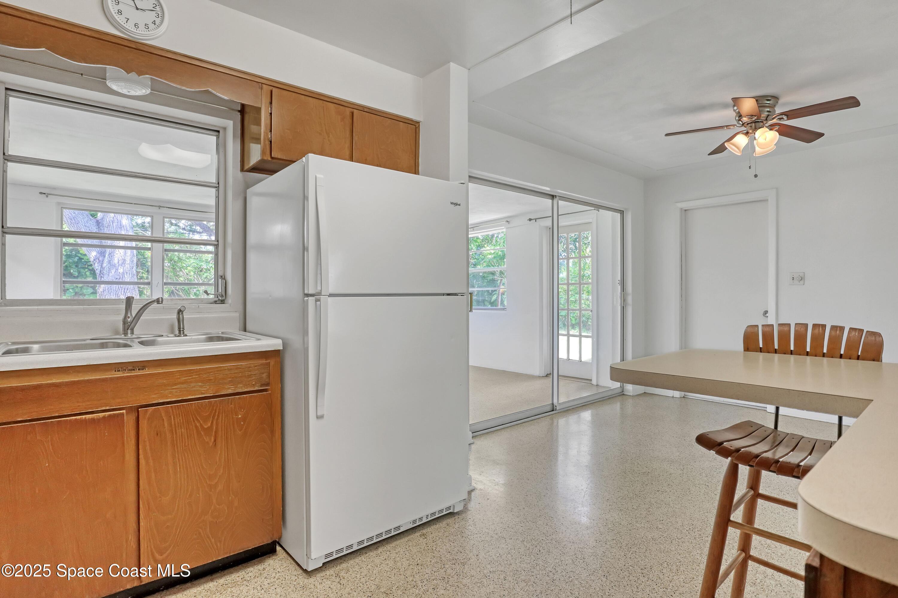 955 Samar Road Cocoa Beach, FL 32931 - Photo 18 of 37 a white refrigerator freezer sitting inside of a kitchen