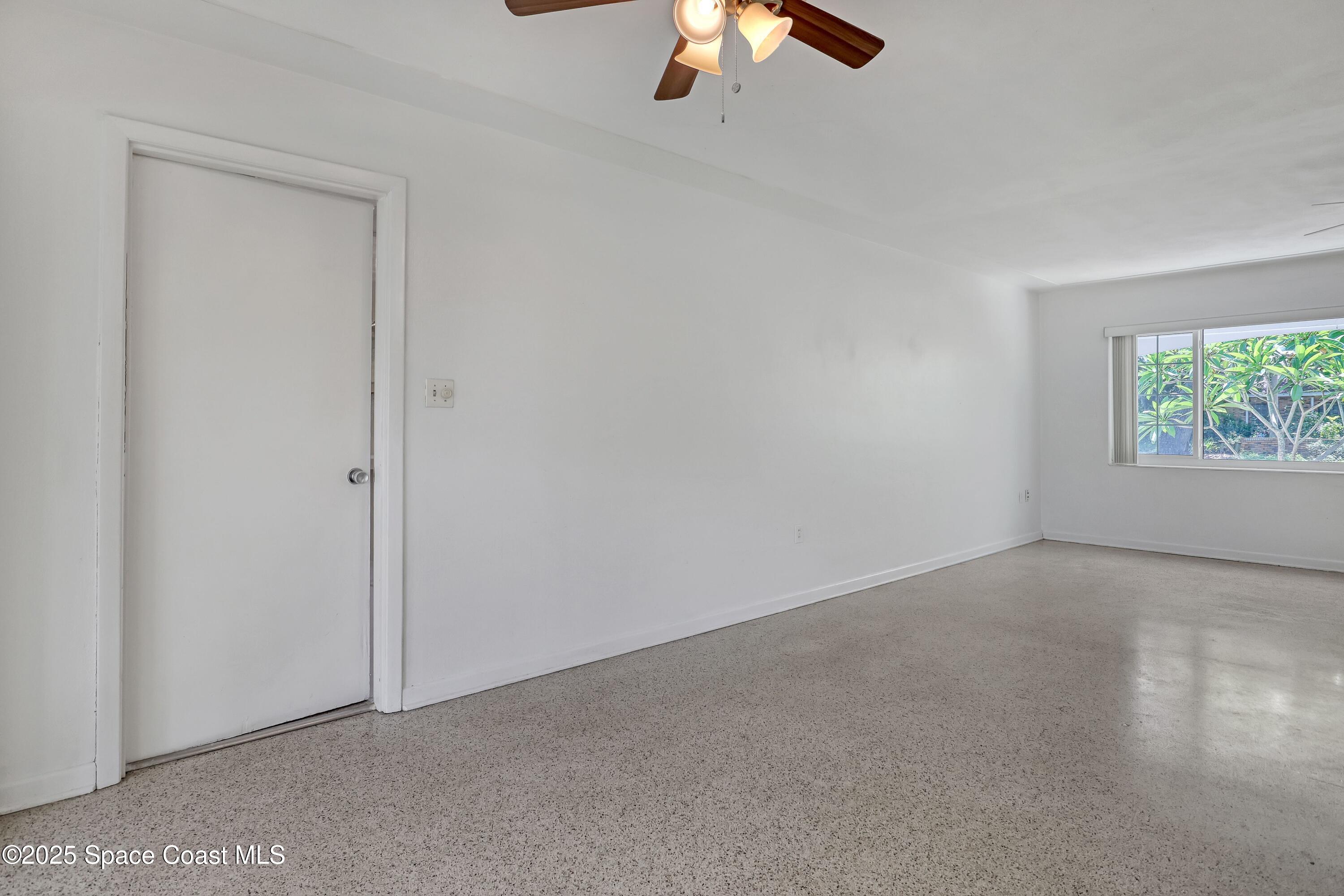 955 Samar Road Cocoa Beach, FL 32931 - Photo 23 of 37 an empty room with windows