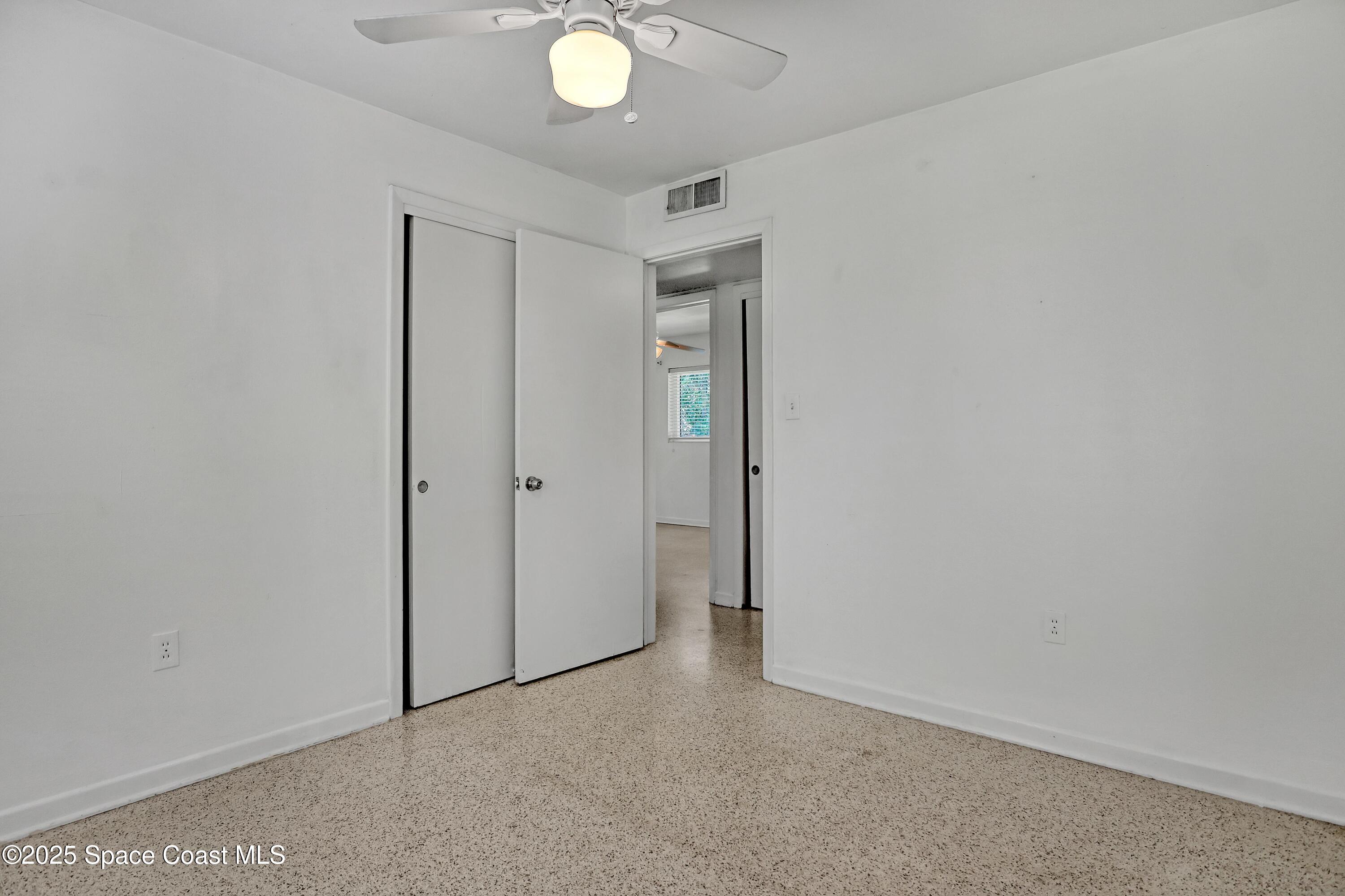 955 Samar Road Cocoa Beach, FL 32931 - Photo 27 of 37 a view of an empty room