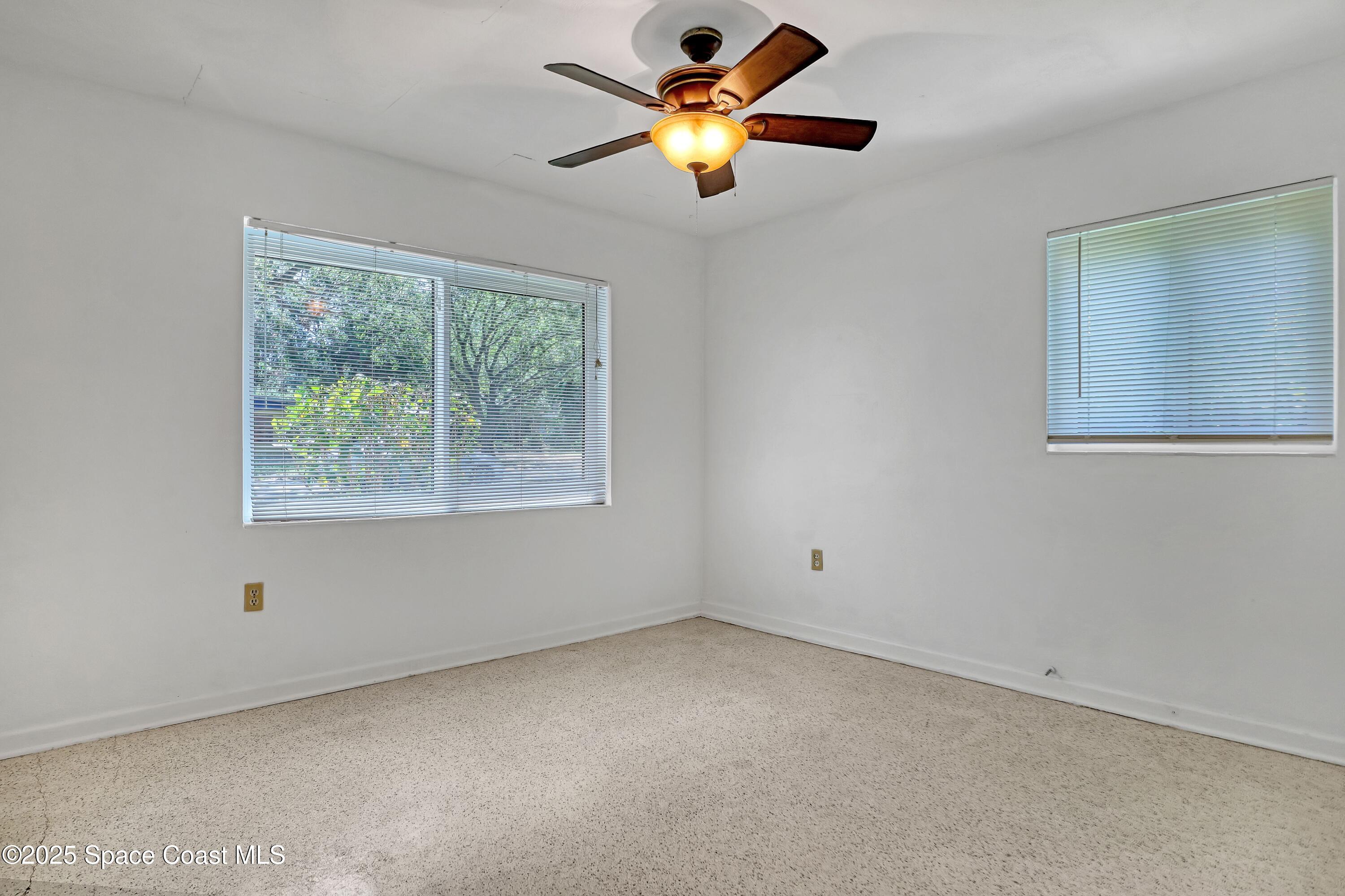 955 Samar Road Cocoa Beach, FL 32931 - Photo 31 of 37 a view of an empty room with a window