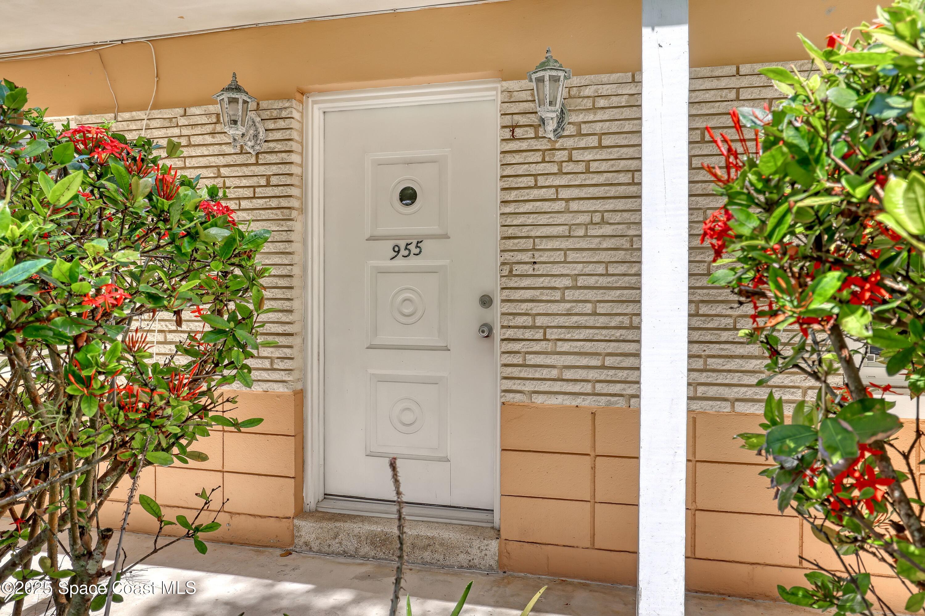 955 Samar Road Cocoa Beach, FL 32931 - Photo 8 of 37 a front view of a building