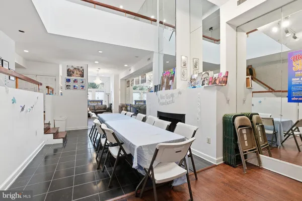 a view of a dining room with furniture and window