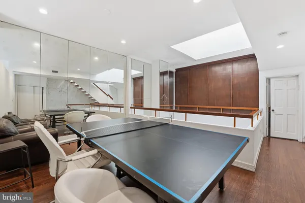 a view of a large kitchen with a table and chairs