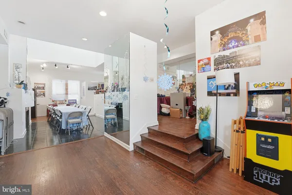 a kitchen with stainless steel appliances granite countertop a refrigerator and a stove