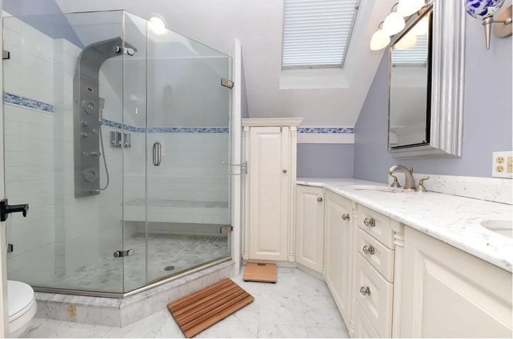 31 Ellisville Road Plymouth, MA 02360 - Photo 22 of 40 a bathroom with a granite countertop sink a toilet and shower