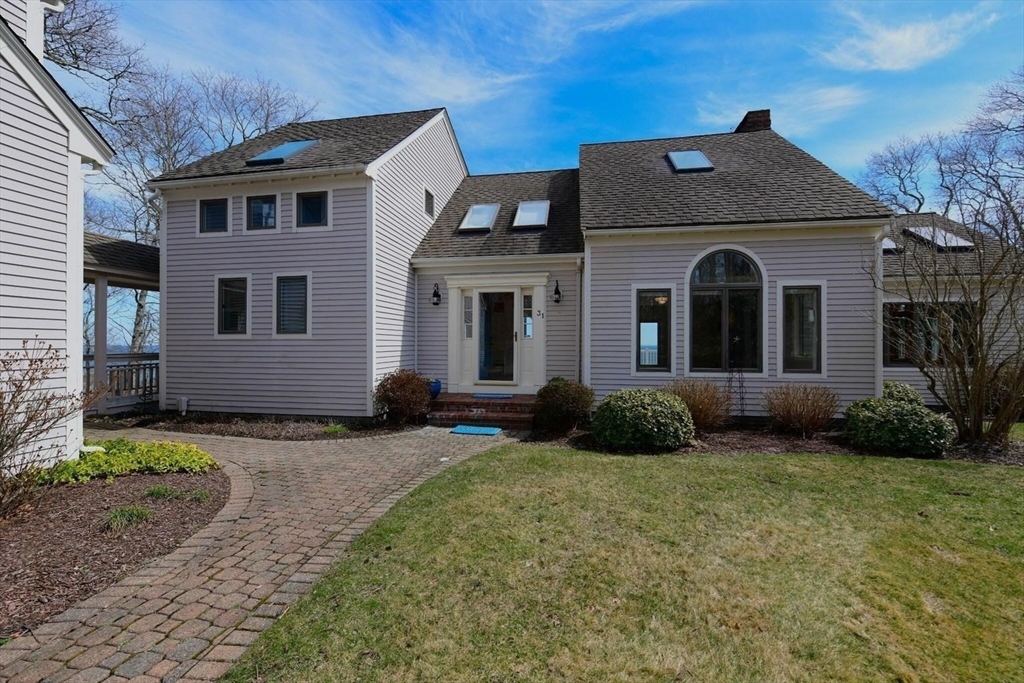 31 Ellisville Road Plymouth, MA 02360 - Photo 3 of 40 a front view of a house with a garden