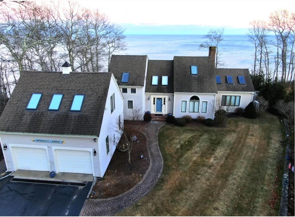 31 Ellisville Road Plymouth, MA 02360 - Photo 4 of 40 an aerial view of a house with large trees