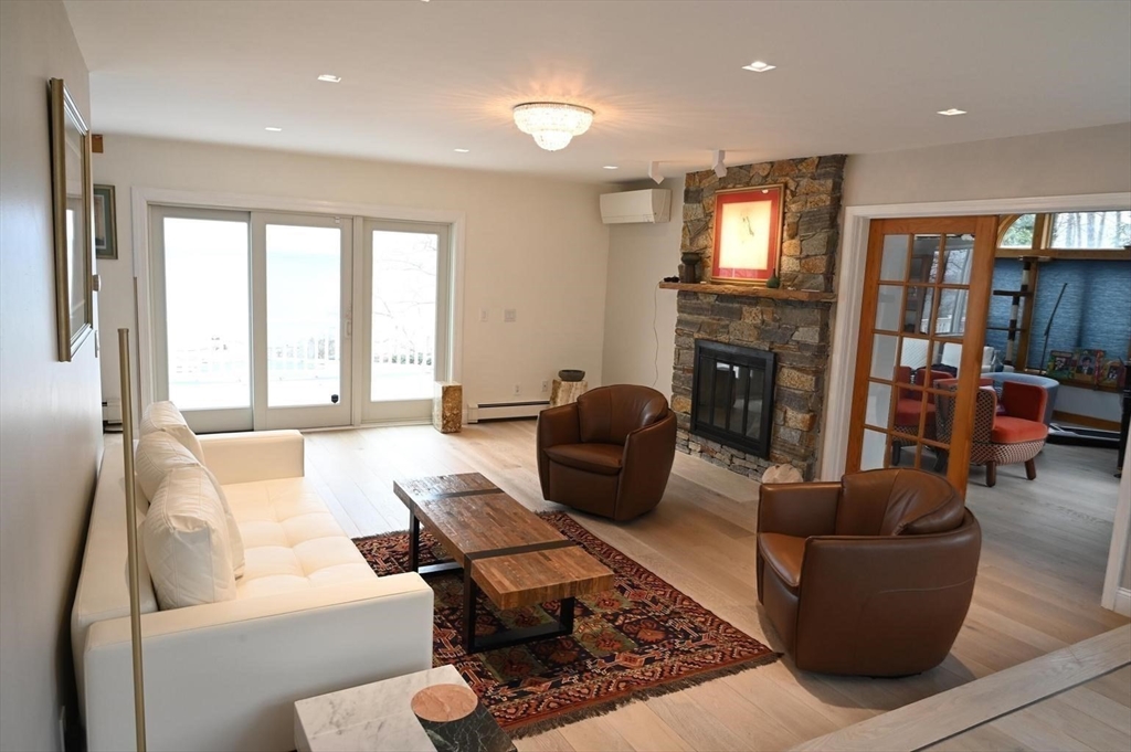 31 Ellisville Road Plymouth, MA 02360 - Photo 9 of 40 a living room with fireplace furniture and a flat screen tv