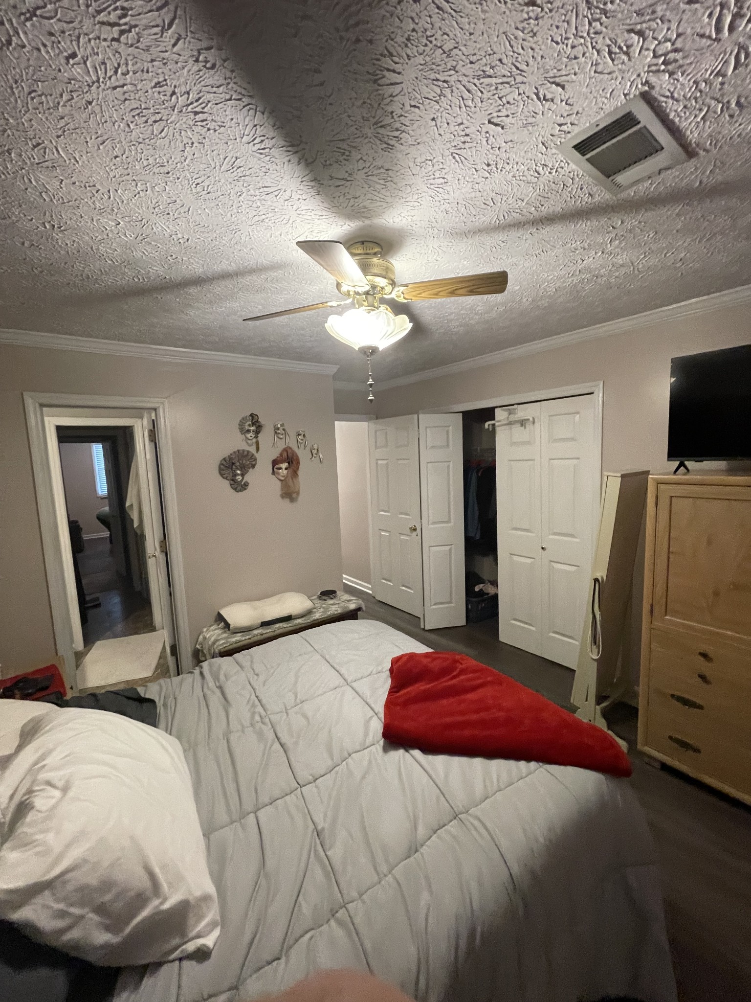 430 Walton Ferry Road, Unit 807 Hendersonville, TN 37075 - Photo 24 of 24 a bedroom with a bed and a flat tv screen on a dresser