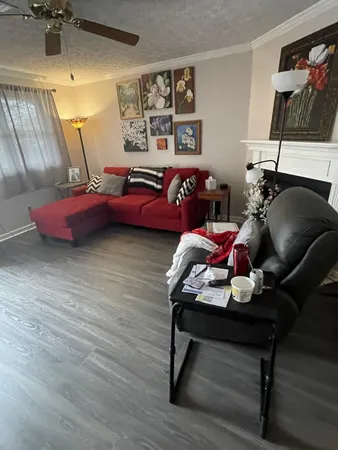 a bedroom with furniture and wooden floor