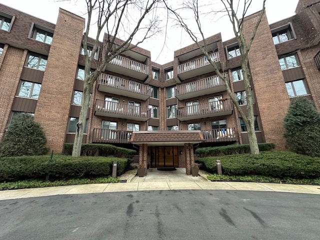 1125 Lake Cook Road, Unit 203E Northbrook, IL 60062 - Photo 1 of 13 a view of a building with a street