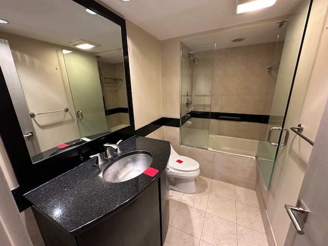 1125 Lake Cook Road, Unit 203E Northbrook, IL 60062 - Photo 12 of 13 a bathroom with a sink toilet and shower