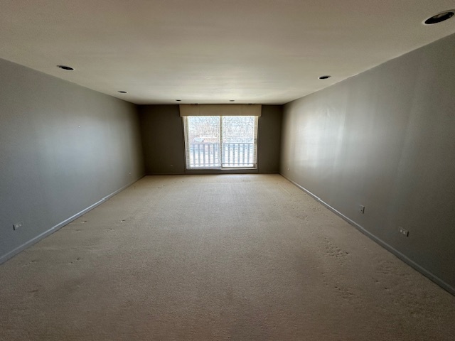 1125 Lake Cook Road, Unit 203E Northbrook, IL 60062 - Photo 4 of 13 an empty room with windows