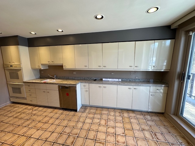1125 Lake Cook Road, Unit 203E Northbrook, IL 60062 - Photo 6 of 13 a kitchen with a sink a stove cabinets and a window
