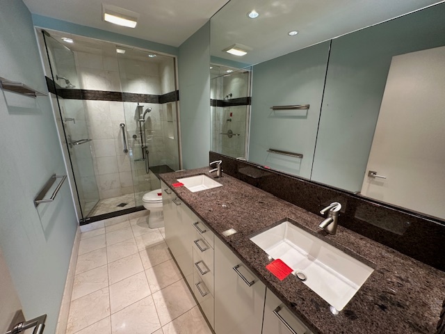 1125 Lake Cook Road, Unit 203E Northbrook, IL 60062 - Photo 10 of 13 a bathroom with a sink a mirror and a shower
