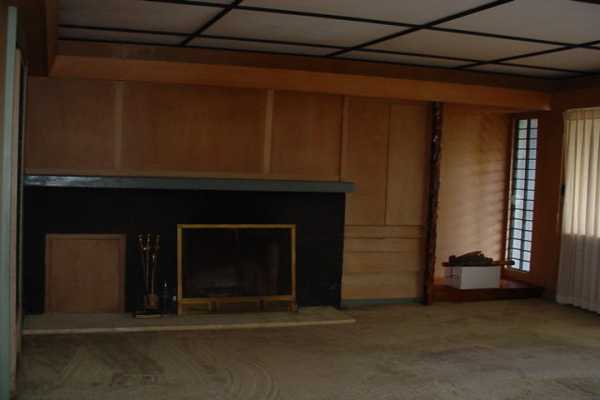 1486 A Akala Road Hilo, HI 96720 - Photo 5 of 5 a living room with a fireplace