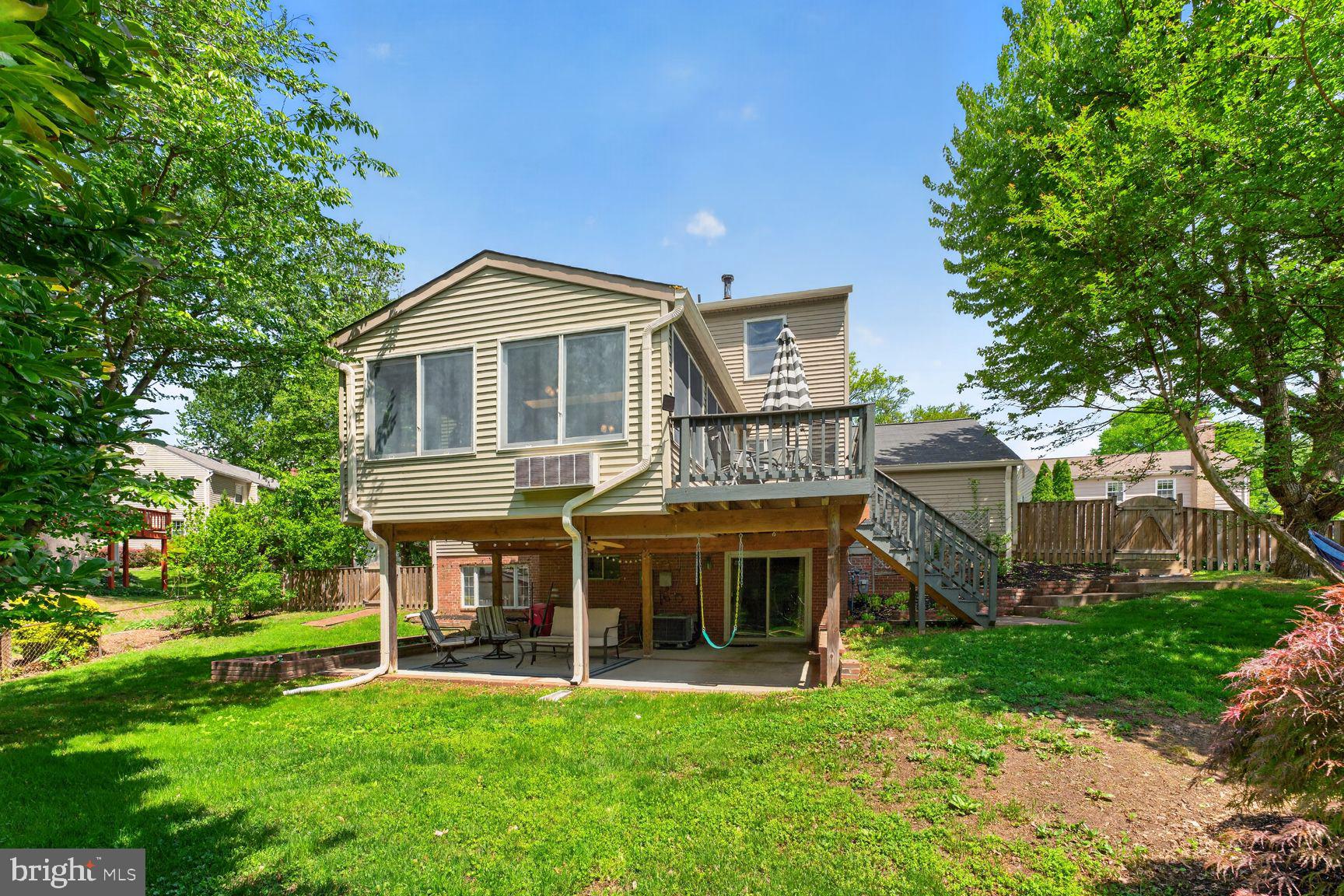 7010 Lamp Post Lane Alexandria, VA 22306 - Photo 24 of 25 Rear elevation of sunroom , deck and patio