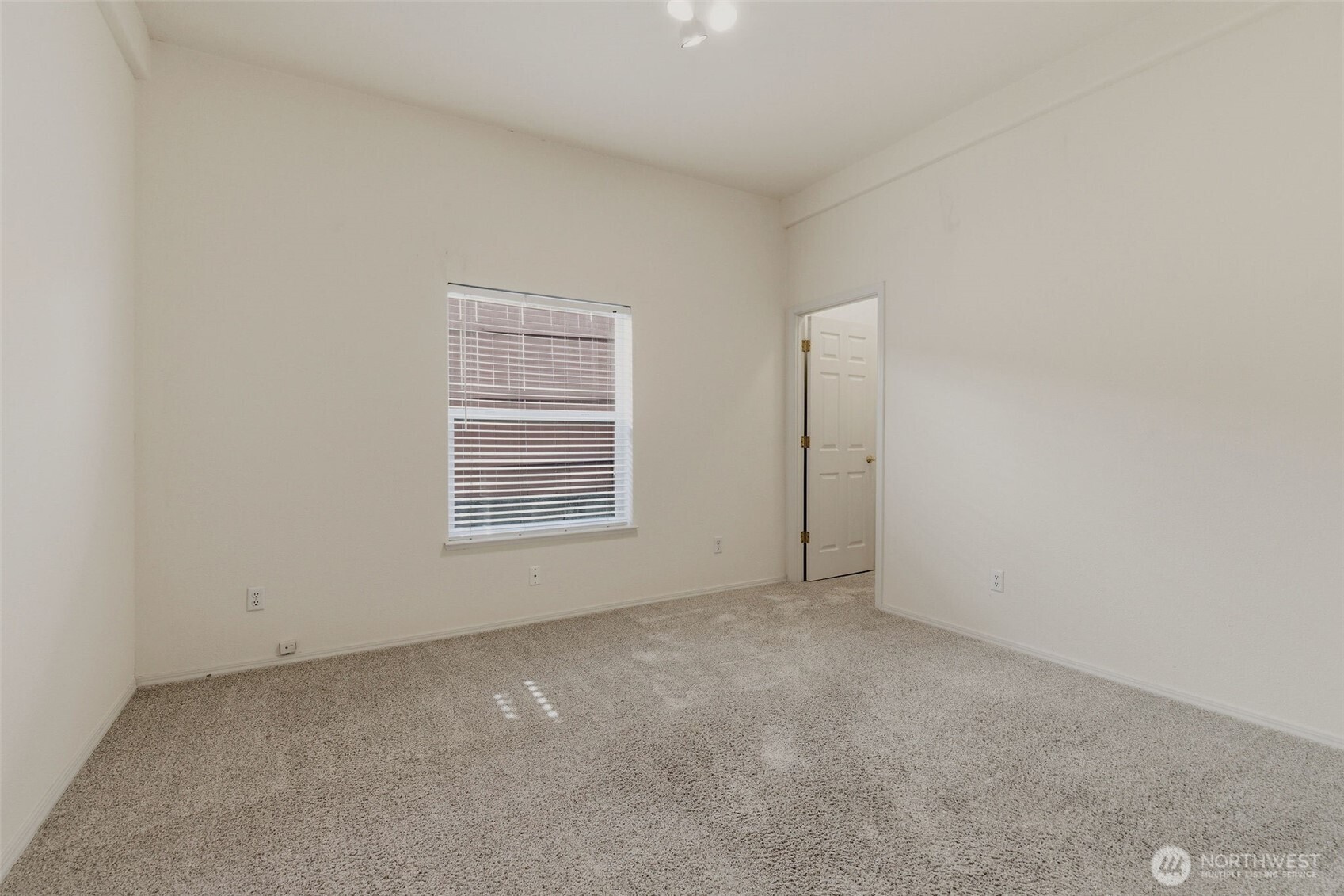 24036 222nd Avenue Southeast Maple Valley, WA 98038 - Photo 17 of 37 an empty room with windows