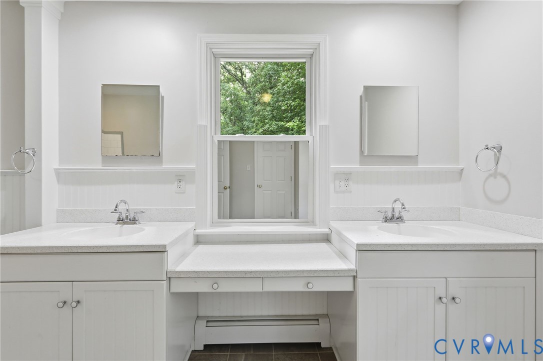 10152 Georgetown Road Mechanicsville, VA 23116 - Photo 21 of 35 a bathroom with a sink and a mirror