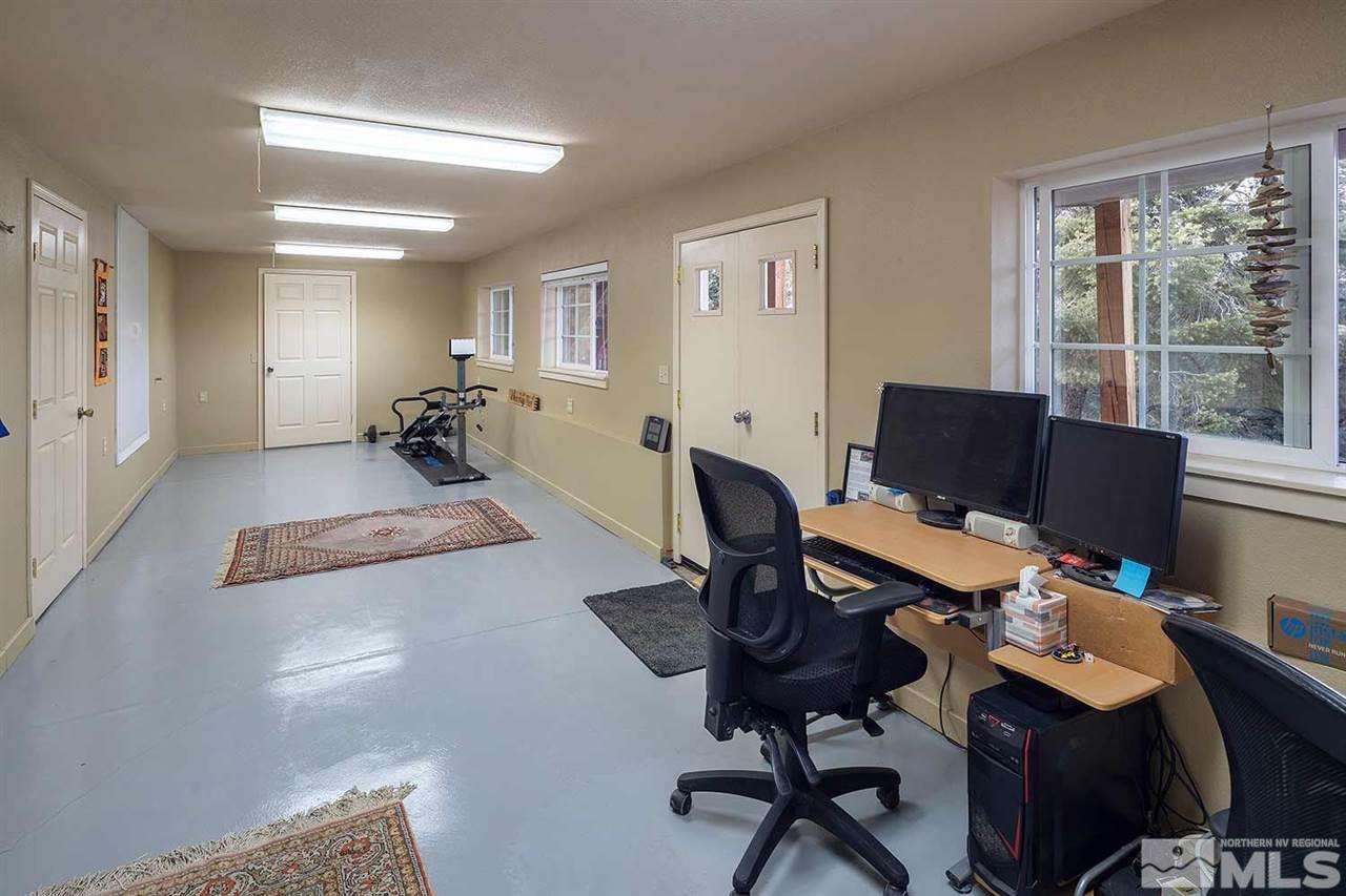21861 Bowie Road Reno, NV 89521 - Photo 18 of 25 a view of a workspace with furniture and a window