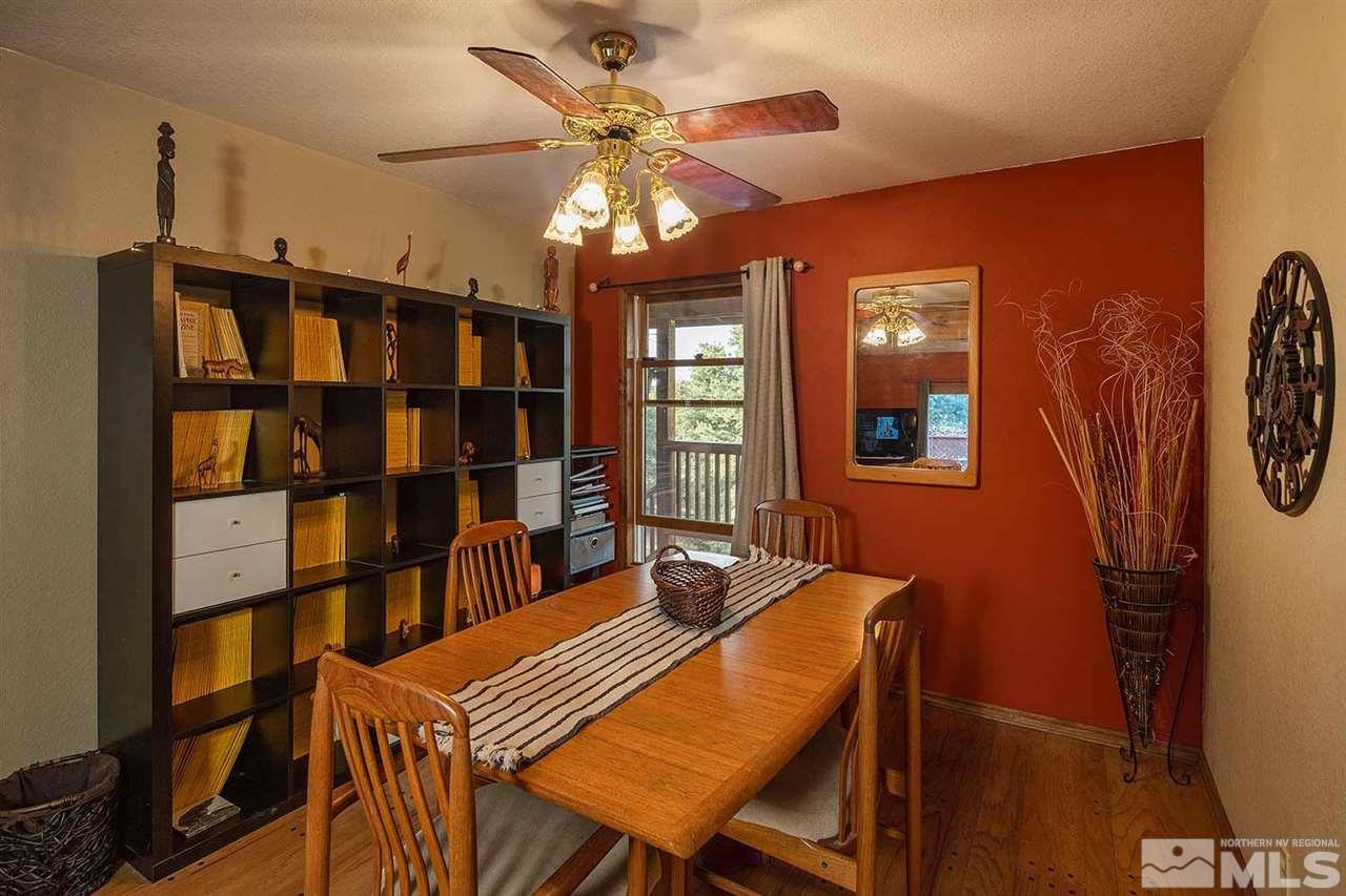 21861 Bowie Road Reno, NV 89521 - Photo 7 of 25 a dining room with furniture and chandelier