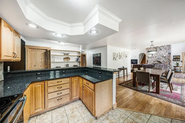 a kitchen with stainless steel appliances granite countertop a stove and a sink