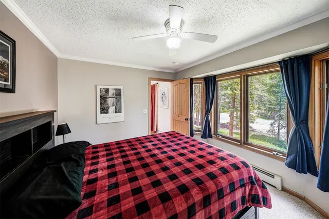 a bedroom with a large bed and a large window