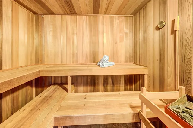 a view of a bedroom with a bed and a window