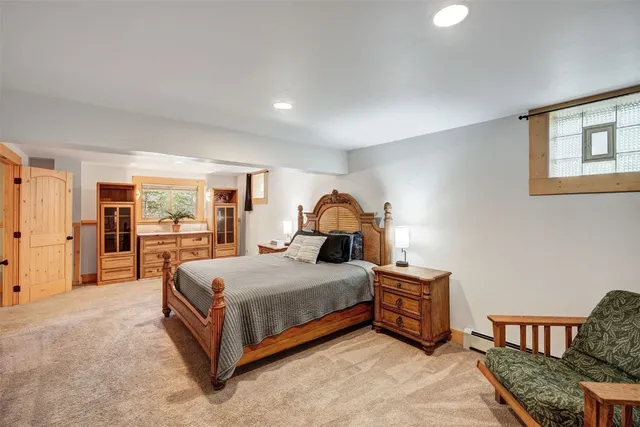 a bedroom with a bed and a dresser