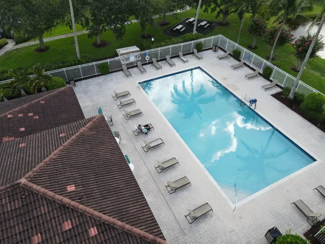 a view of a swimming pool with a patio
