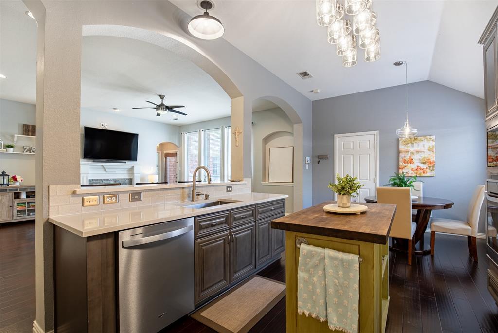 6425 Radslow Drive Frisco, TX 75035 - Photo 16 of 34 Kitchen with breakfast bar to living room.