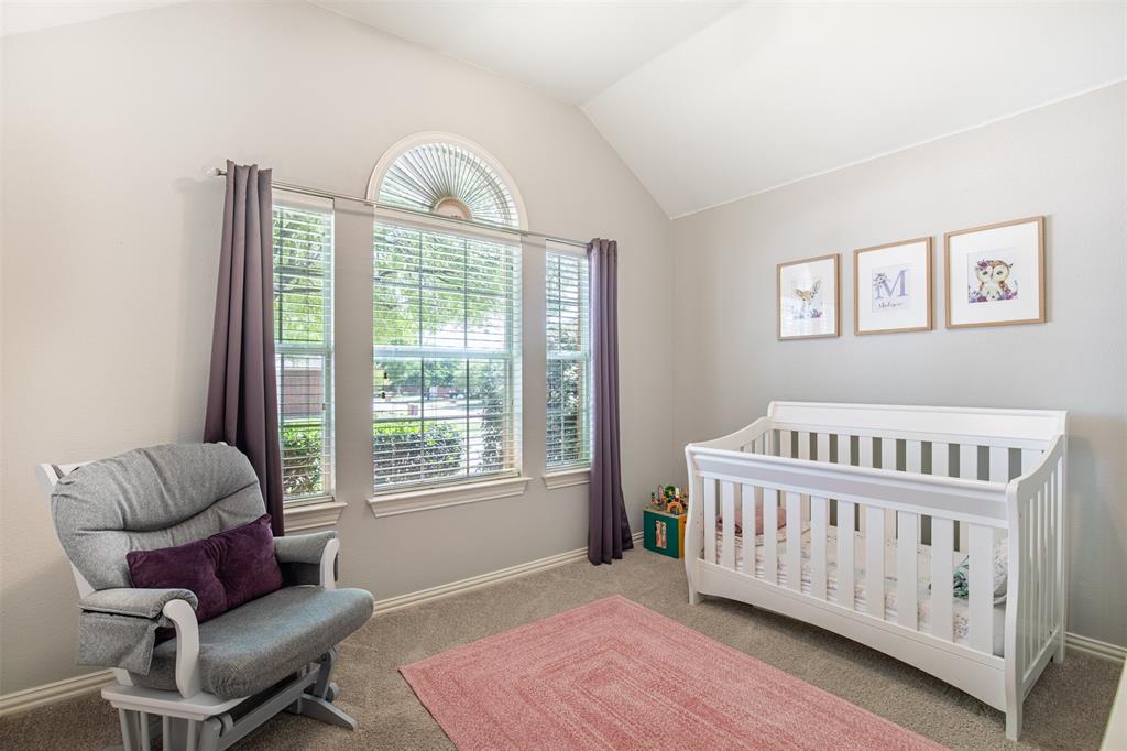 6425 Radslow Drive Frisco, TX 75035 - Photo 24 of 34 Secondary bedroom with sloped ceiling and natural light.