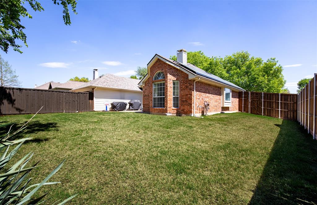 6425 Radslow Drive Frisco, TX 75035 - Photo 33 of 34 Back of house showcasing spacious side yard.