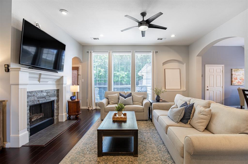 6425 Radslow Drive Frisco, TX 75035 - Photo 5 of 34 Living room with wall of windows overlooking the backyard.