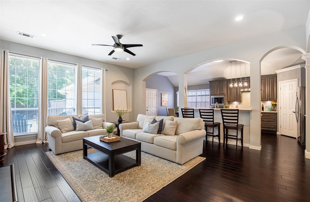 6425 Radslow Drive Frisco, TX 75035 - Photo 7 of 34 Open concept living to kitchen.