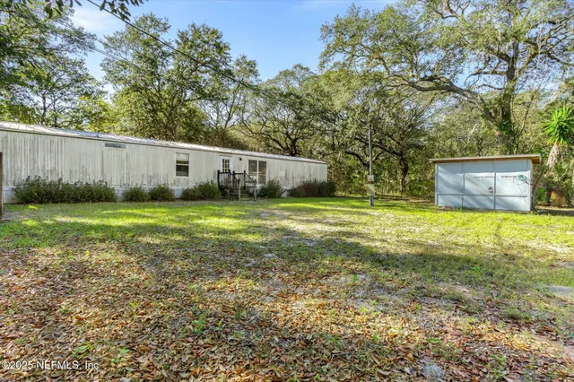 a backyard of a house with lots of green space