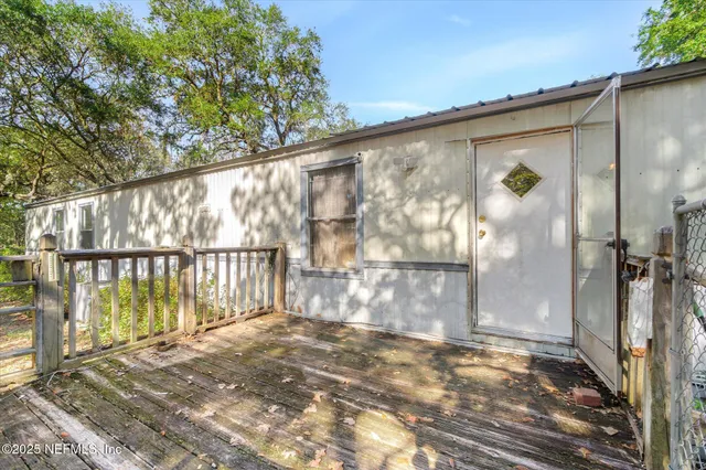 a view of road with large trees