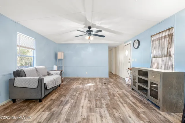 a living room with furniture and a window