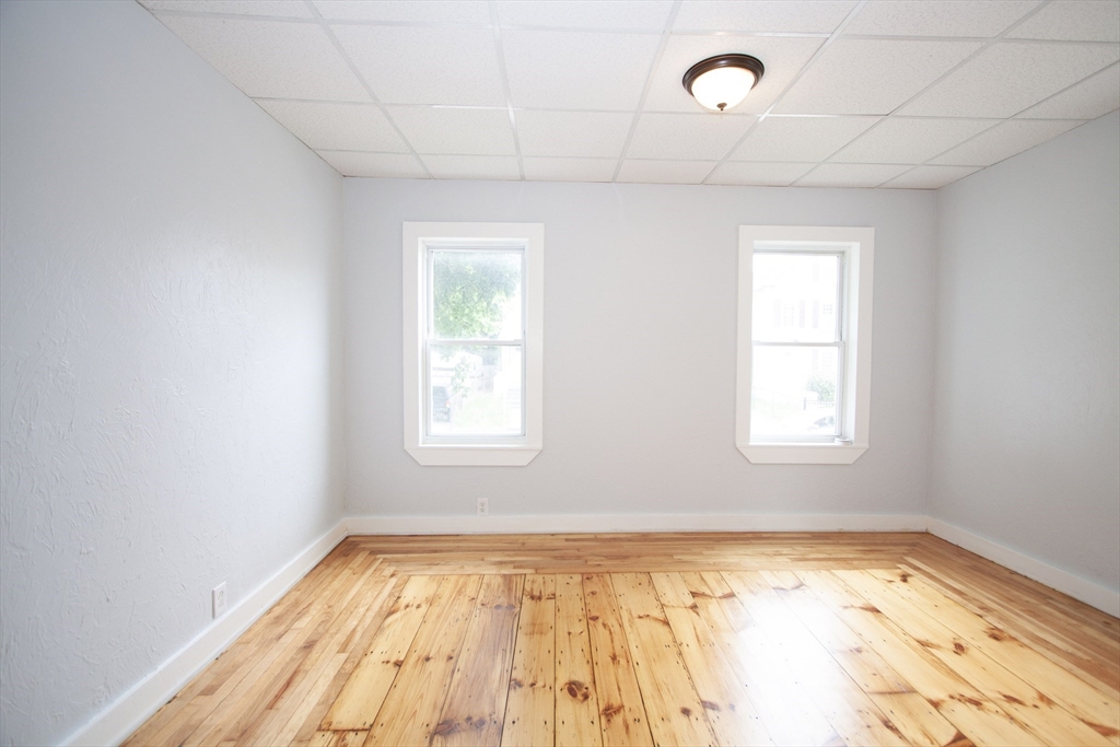 66 Cutler Street Worcester, MA 01604 - Photo 13 of 27 a view of empty room with wooden floor