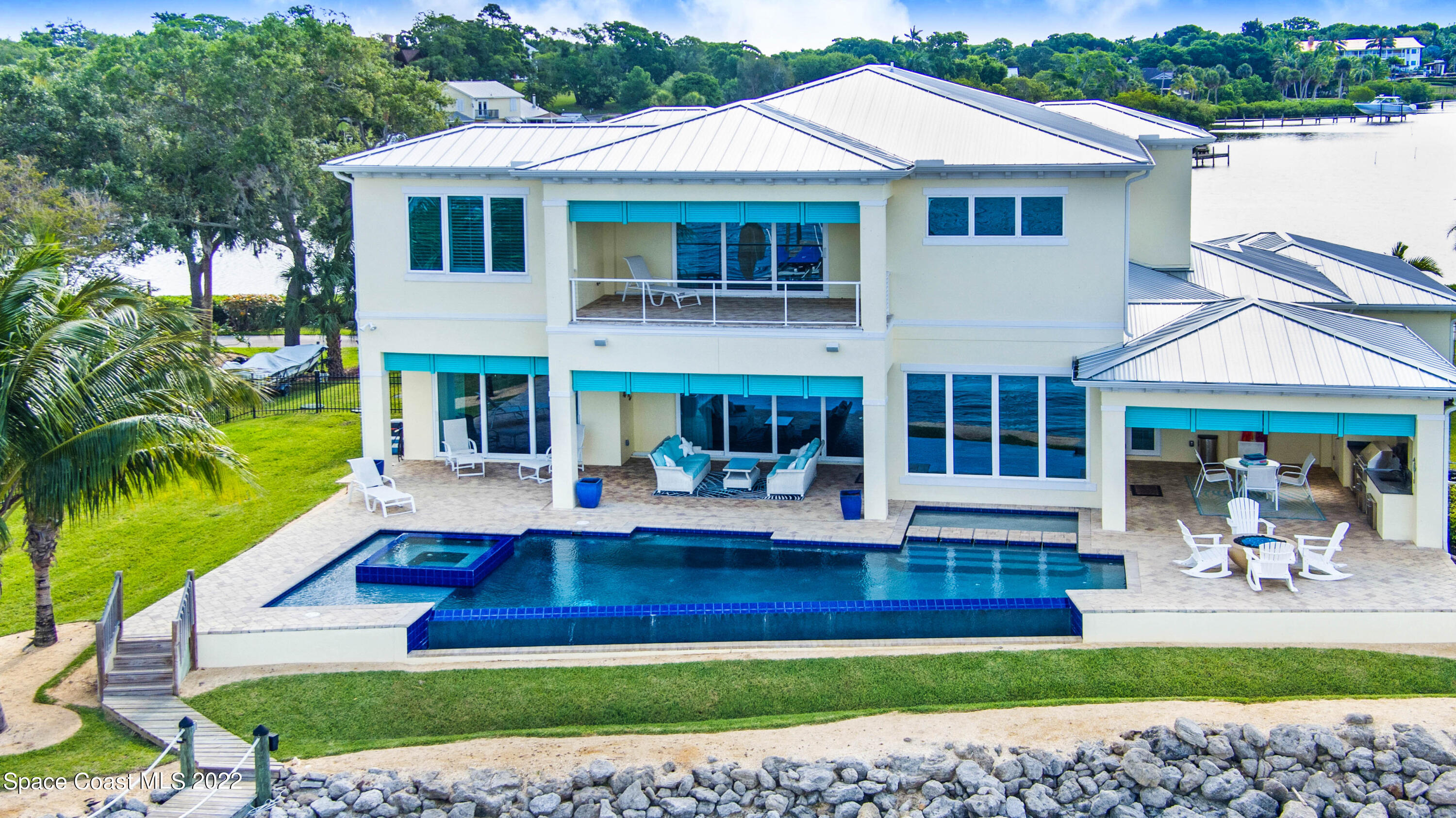 4325 Randon Lane Merritt Island, FL 32952 - Photo 8 of 68 Disappearing Edge Pool, Coquina Seawall