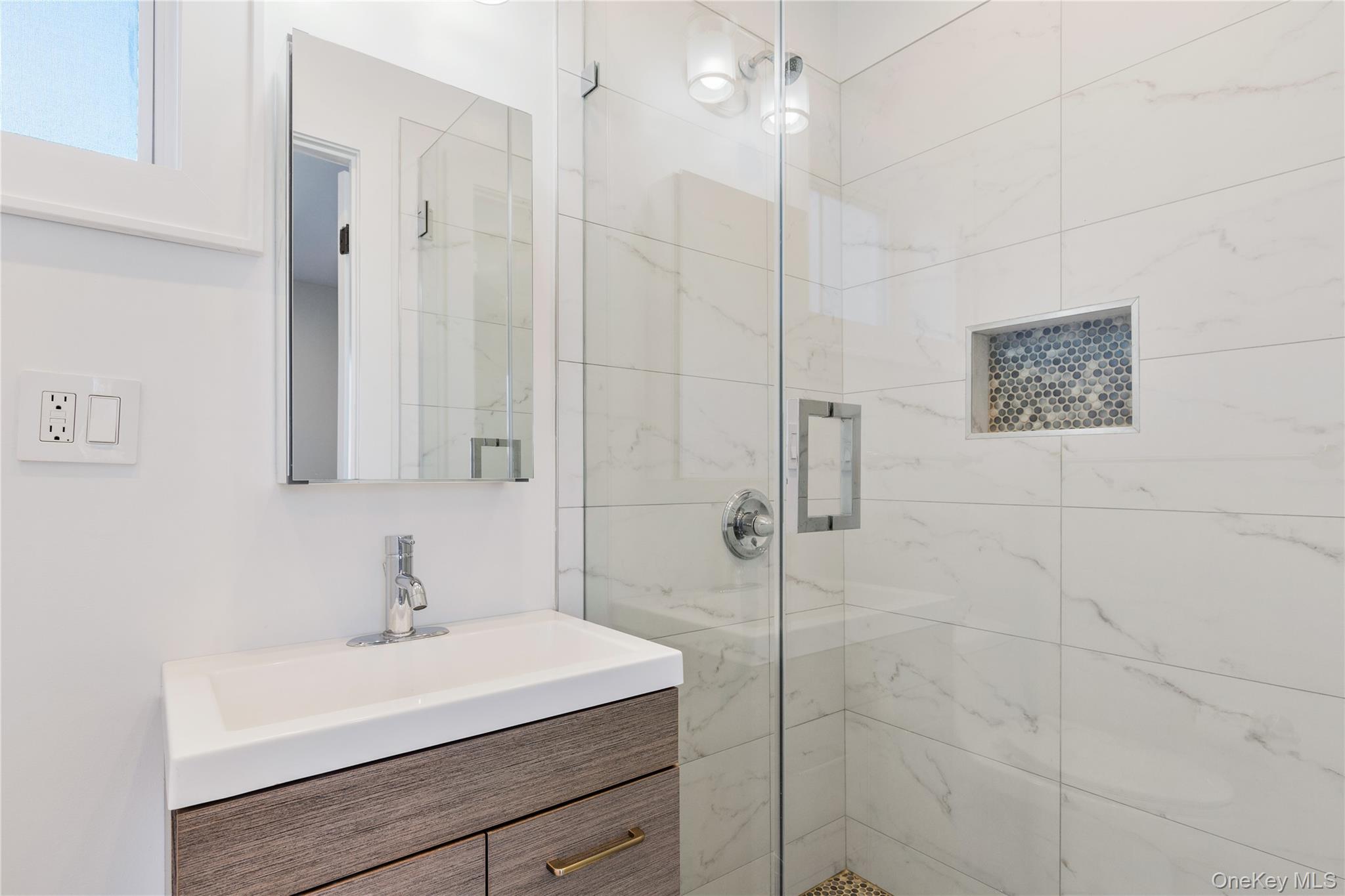 385 Midland Avenue, Unit 2 Rye, NY 10580 - Photo 16 of 20 a bathroom with a sink a toilet and shower