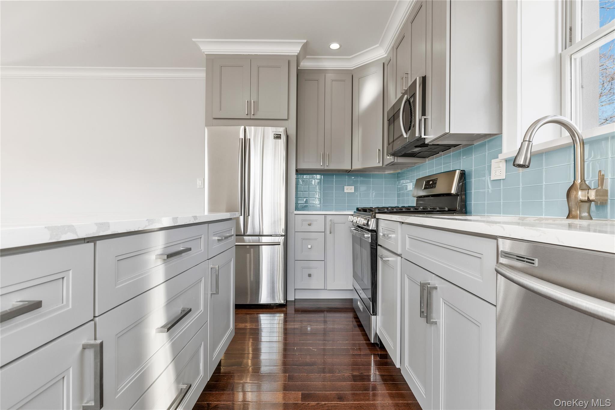 385 Midland Avenue, Unit 2 Rye, NY 10580 - Photo 8 of 20 a kitchen with stainless steel appliances granite countertop a refrigerator sink and cabinets